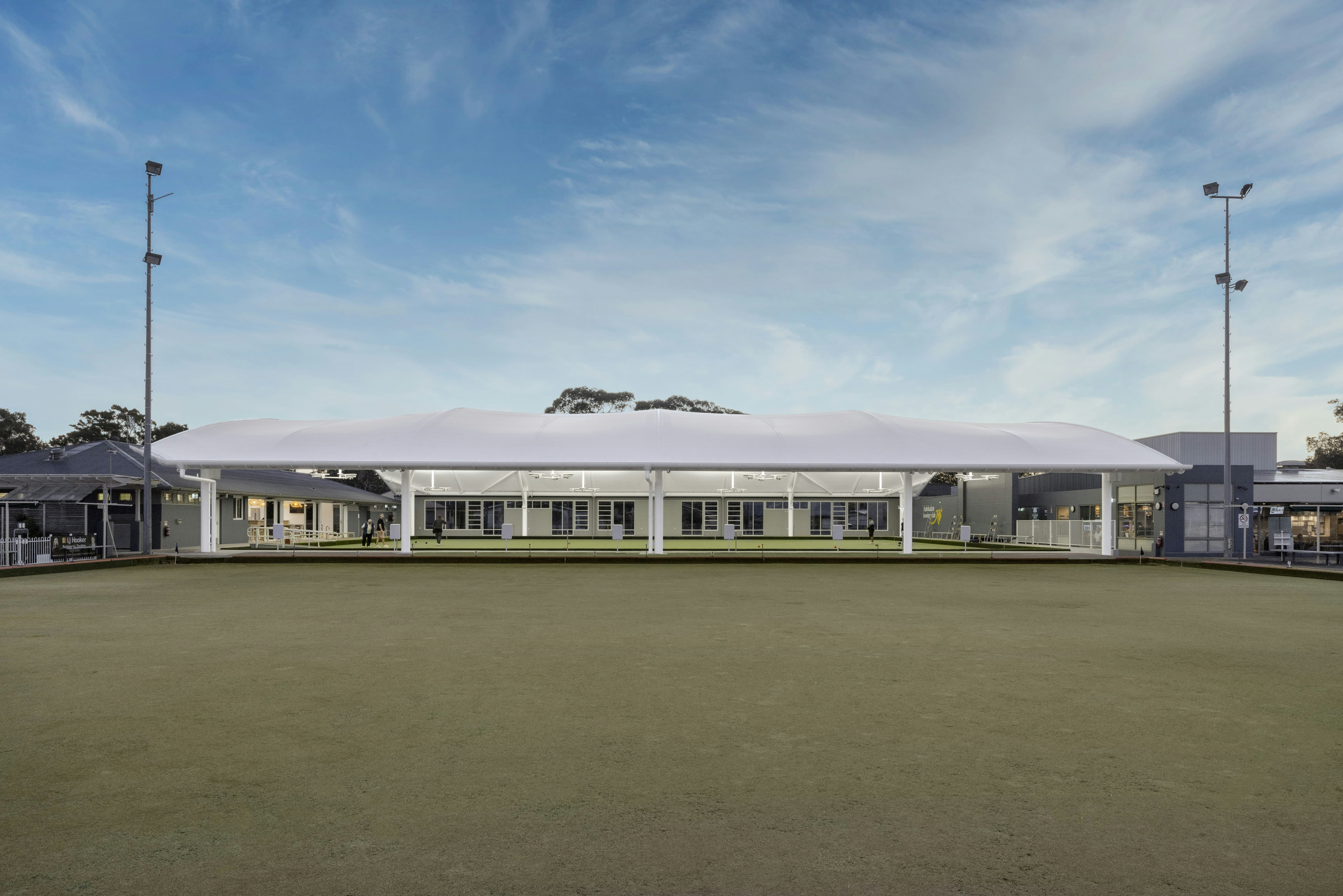 Covered bowling green and clubhouse at Halekulani Bowling Club.