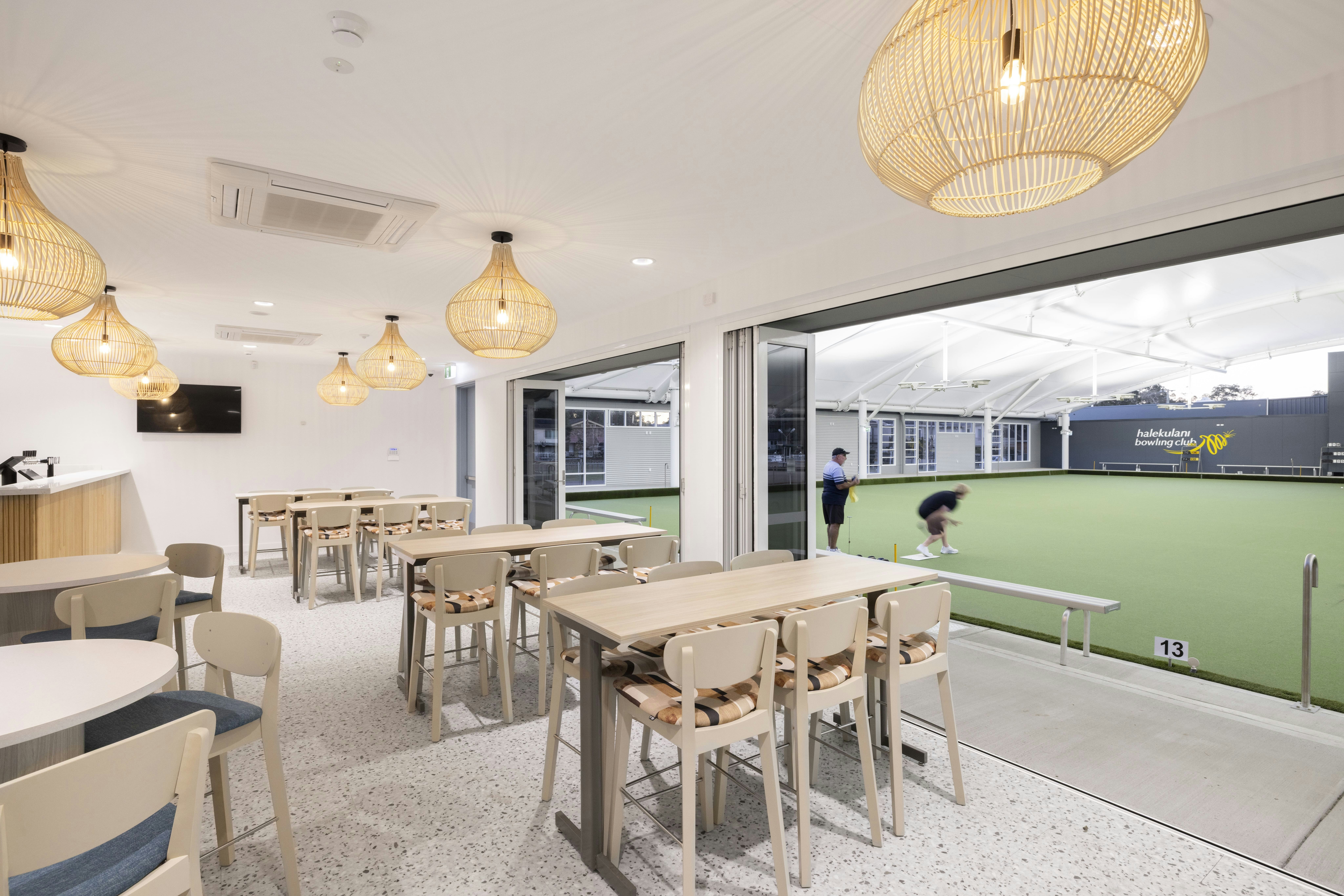 Halekulani Bowling Club seating area opening onto the covered bowling green.