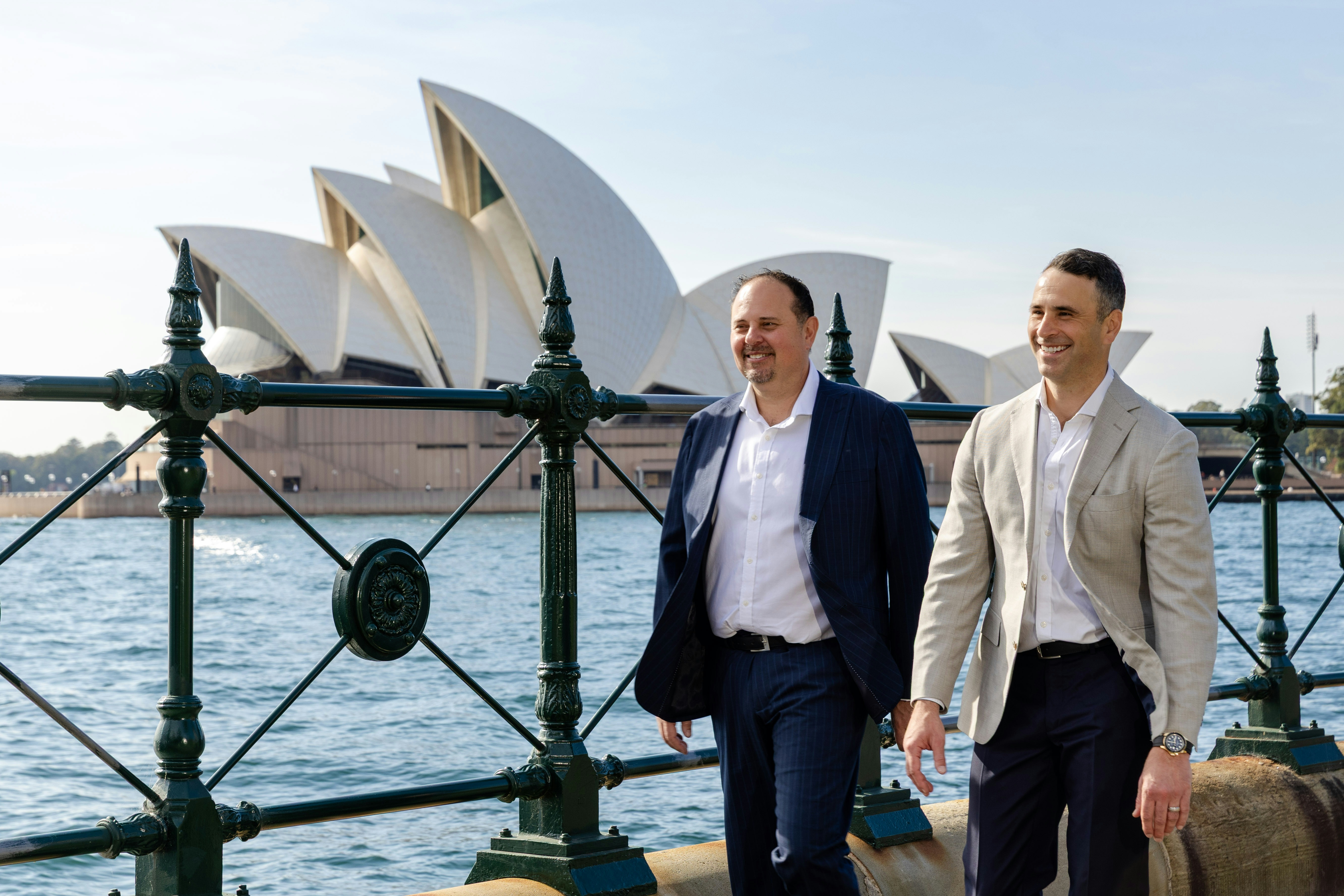 Aston Chace Group team members walking beside Sydney Harbour.